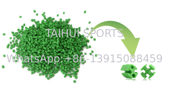 L'herbe synthétique de résistance aux intempéries était à la base des granules en caoutchouc réutilisés pour le terrain de football du football